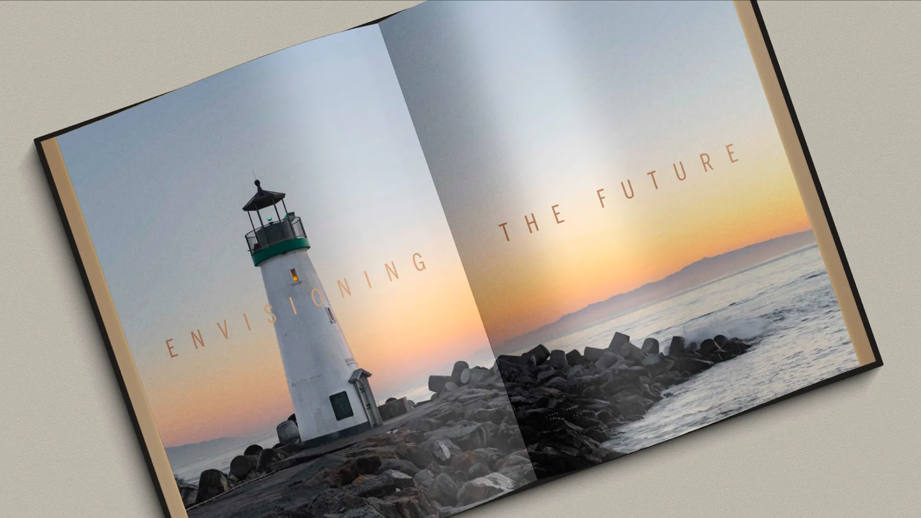 Open brochure spread: a lighthouse at sunset with the words “Envisioning the future”