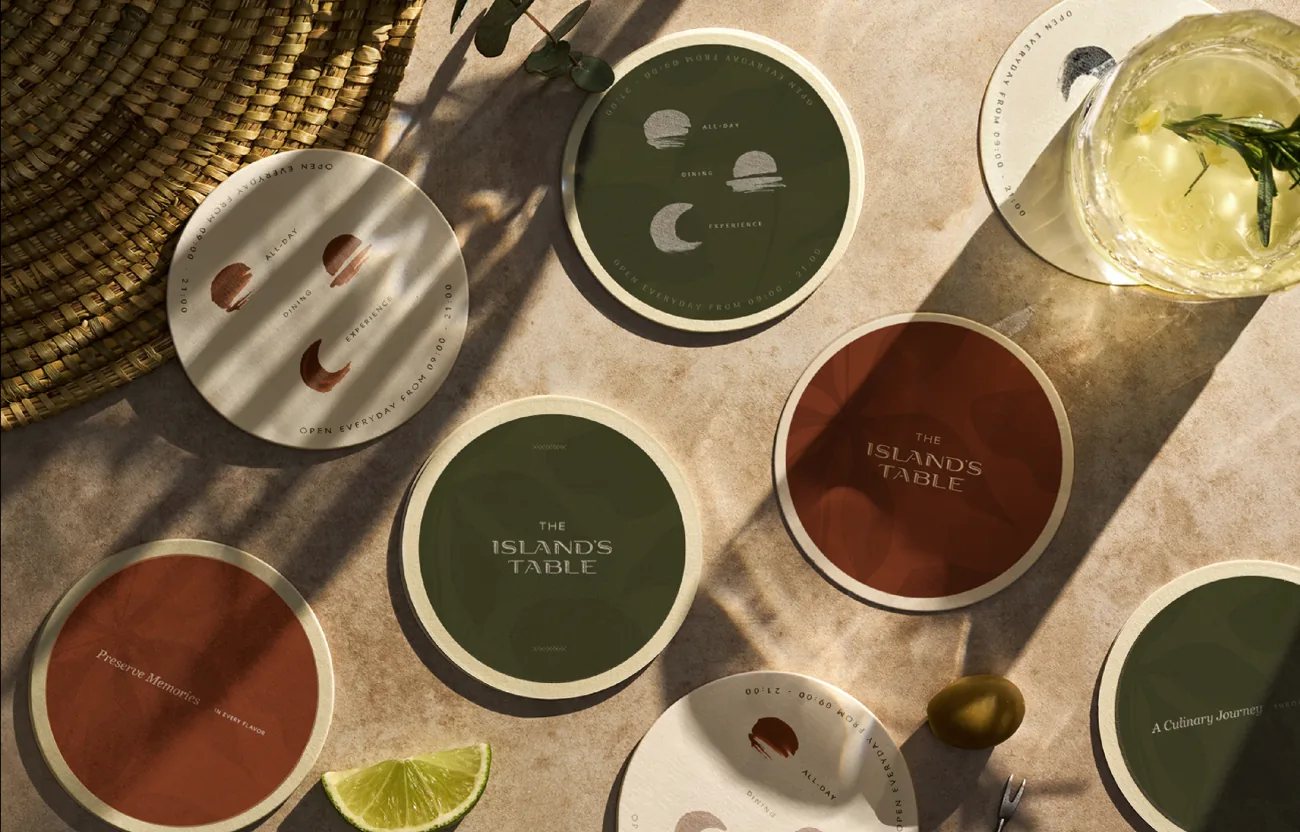 Round coasters in olive and terracotta with brand symbols