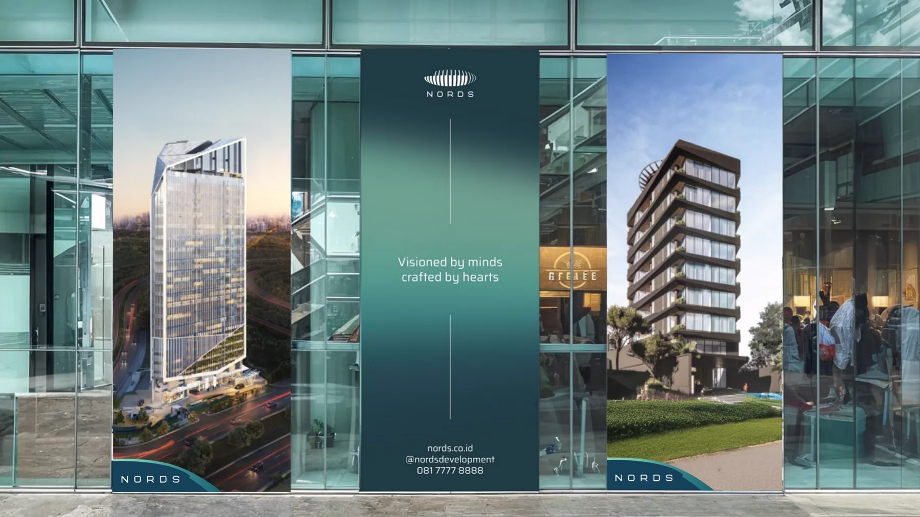 Nords banners in a glass lobby with two towers and the line “Visioned by minds, crafted by hearts”