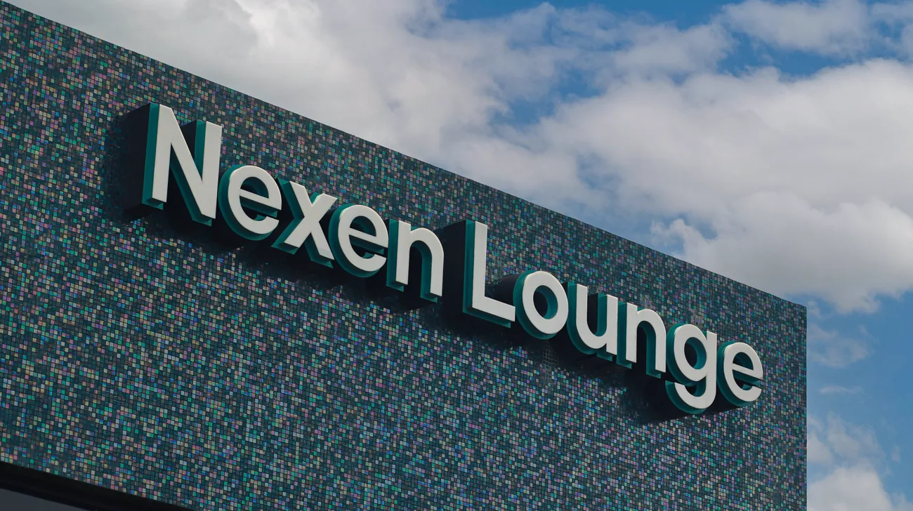 Three-dimensional “Nexen Lounge” lettering on a textured teal wall